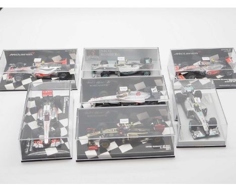 A group of 1:43 scale Formula 1 race cars by MINICHAMPS, comprising of F1 cars from 2010 and 2011 seasons, to include a 2010 