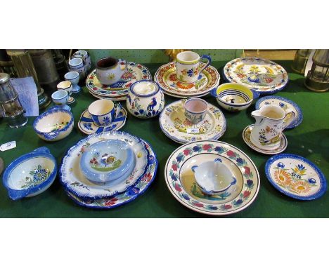 A large miscellaneous quantity of Quimper Ware, to include: plates, cups, saucers, bowls, jugs and other related china.