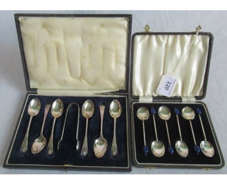 A cased set of six silver coffee spoons, each having a blue bean finial, together with a cased set of silver teaspoons and su