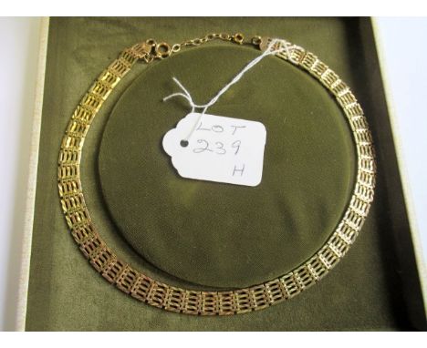 A 9ct gold fancy gate link collar necklace in fitted case, with additional links. Condition Report: 29.8 grams.