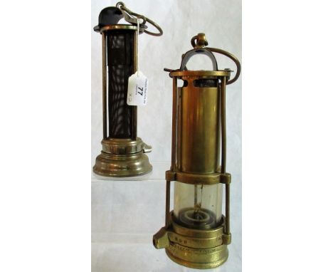 A J. R. Hill miner's safety lamp, together with a Davy safety lamp.