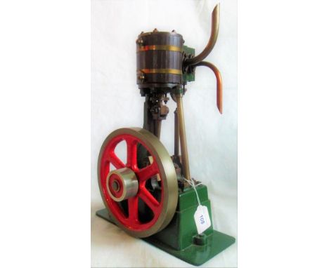 A Stuart stationary steam engine. Condition Report: Height at highest point 40cm.