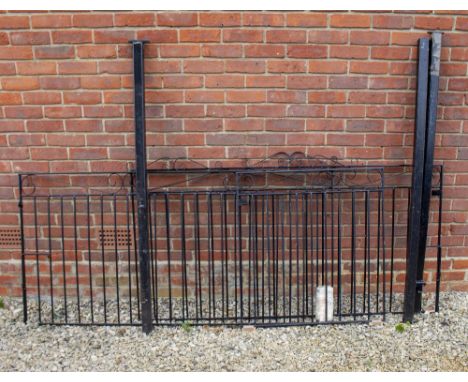 A PAIR OF BLACK PAINTED WROUGHT IRON DRIVEWAY GATES each gate 175.5cm wide x 94cm high together with a matching pedestrian ga