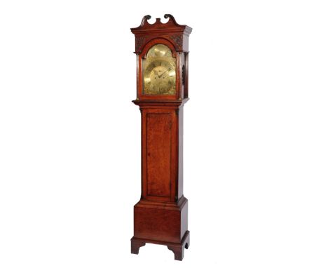 A MAHOGANY EIGHT DAY LONGCASE CLOCK, the 13" brass break arch dial with Roman chapter ring, Arabic five minutes, the scroll e