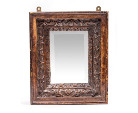 A SMALL CARVED OAK MIRROR 30cm x 36cm together with an old carving of a soldier, 45cm high (2)
