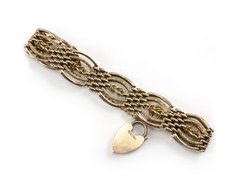 A 9 CARAT GOLD FANCY LINK GATE BRACELET with heart padlock clasp, 21 grams in weight approximately overall