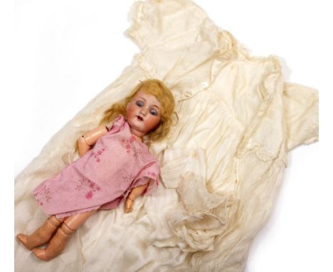 AN ARMAND MARSEILLE GERMAN BISQUE HEADED DOLL number 390, 30cm in length 