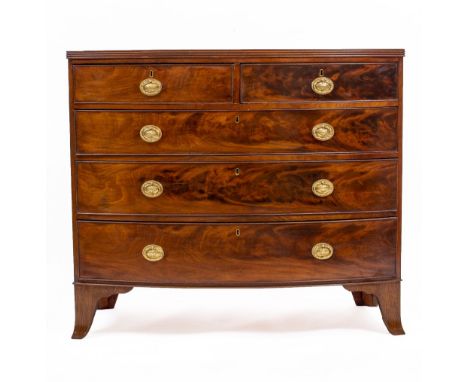 AN EARLY VICTORIAN MAHOGANY BOW FRONTED CHEST OF TWO SHORT AND THREE LONG DRAWERS with brass oval ring handles and raised on 