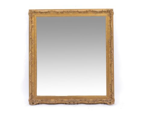 A GILT FRAMED WALL MIRROR 93cm wide x 107cm high