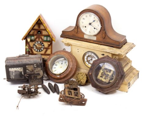 AN OAK CIRCULAR DIAL CLOCK CASE with carved decoration, 21cm diameter together with two mantle clocks, two American shelf clo