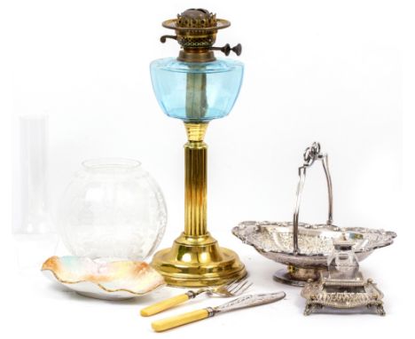 AN OLD OIL LAMP with etched shade and blue glass reservoir together with a silver plated glass inkwell, a silver plated bread
