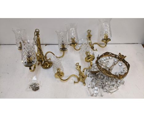 A late 20th century brass chandelier with glass shades and a pair of matching wall lights and a brass framed bag light with g