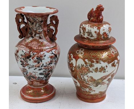 Two Japanese Kutani Meiji period vases, one painted with panels of figures and birds and the lid with a foo dog finial, 17.5c