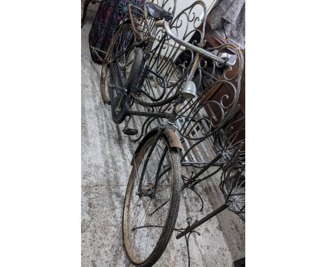 A vintage BSA shop bike, painted black, with leather saddle, bicycle lamp and bell Location:If there is no condition report s