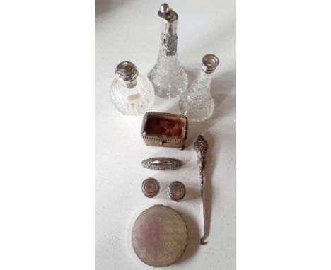 A quantity of early 20th century dressing table items to include silver and white metal topped glass pots and jars A/F, a gol