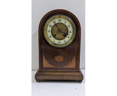 An Edwardian mahogany arched top mantel clock, the 8-day movement striking on a gong, 27.5cm hLocation:If there is no conditi