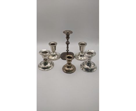 Two pairs of silver dwarf candlesticks, a taper style stick and anotherLocation:If there is no condition report shown, please