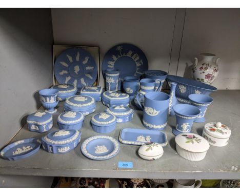 A collection of Wedgwood light blue Jasper wares to include a boxed Elizabeth II commemorative plate, boxes, vases, pin trays