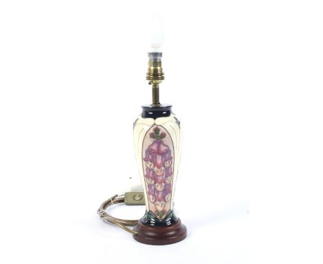 A Moorcroft Foxglove pattern table lamp. Of baluster form, designed by Rachel Bishop, circa 1993, on wooden base, 23.3 cm hig