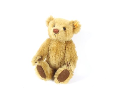 A late 20th century Steiff Teddy Bear  with blonde Mohair covering,, stitched nose, label to ear, articulated head, hinged le