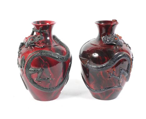 Burslem Artwares, a pair of Royal Doulton Flambe Fuyang dragon vases, nos `23 & 59 /1999, bears sticker under for DB undeer ,