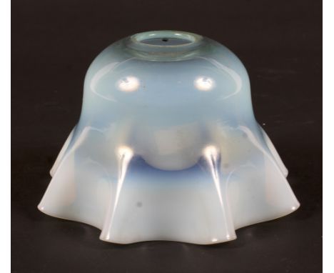 An Edwardian vaseline glass oil lamp shade in the style of James Powell, Whitefriars. Of frilled form, of green-blue tint, 13