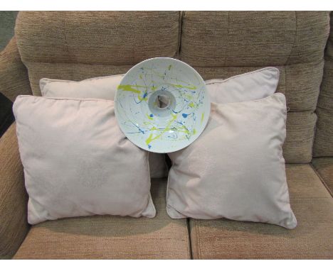 A metal lampshade with blue and yellow splash design, 29cm diameter with four light pink coloured cushions