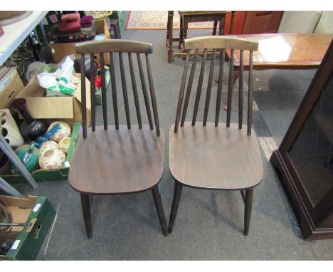 A set of four stick back chairs and a drop-flap table