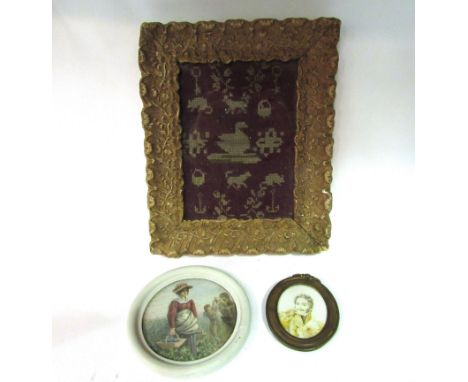 A miniature gilt framed sampler 18cm x 13cm and two miniature pictures including lady collecting grapes