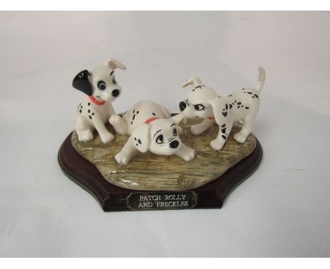 A Royal Doulton limited edition Disney's 101 Dalmations - Patch, Rolly and Freckles with certificate and stand, model No. DMS