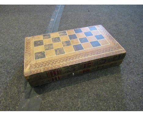 A folding chess/draughts board as faux books, with draught counters