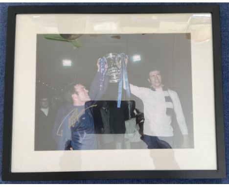 Football Ron 'Chopper' Harris Signed 16x12 inch Colour Print Showing Harris and one other Lifting a Trophy. Housed in a Frame