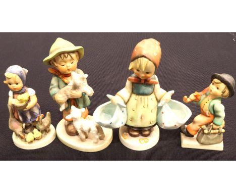 Two large and two small Hummel/Goebel figurines. P&amp;P Group 3 (£25+VAT for the first lot and £5+VAT for subsequent lots) 