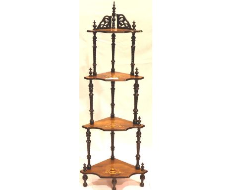An Edwardian inlaid walnut etagere with four graduated shelves, turned supports and finials, 38 x 38 x 148 cm H. Not availabl