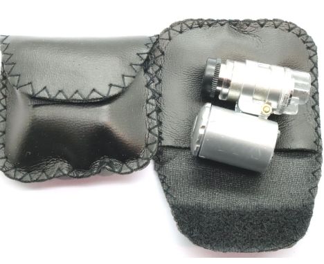 New old stock two cased 60x magnification currency detecting jewellery loupes with LED lights. P&amp;P Group 1 (£14+VAT for t