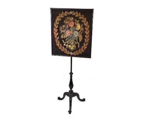 Embroidered mahogany polescreen, the rectangular panel 61cm x 52.5cm, on leaf-carved tripod support with scroll feet, 134cm h