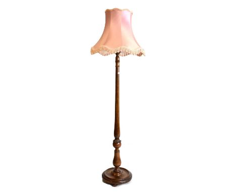 Carved walnut standard lamp, with pink shade, 175cm high 