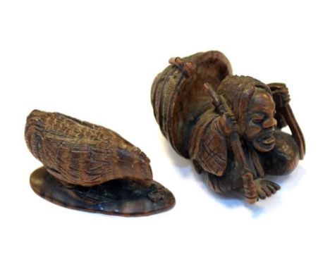 Two carved Japanese netsuke, probably hardwood, comprising a hen observing a worm, incised signature, and a figure with overs