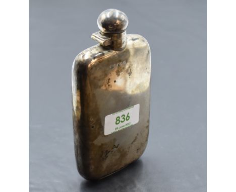 An Edwardian silver hip flask, of rounded rectangular form, curved for the gentleman's pocket, marks for Sheffield 1905, make