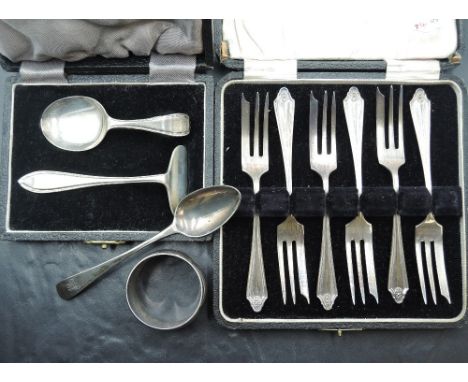 A cased set of six silver cake forks having moulded decoration to terminals, Birmingham 1925, William Suckling Ltd, a Georgia