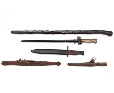 A 20th Century carbine bayonet, single edged blade, wooden grip with screw bolts, with black metal scabbard, 31cms overall; a