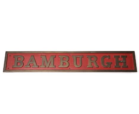 A late Victorian steam engine locomotive nameplate 'Bamburgh', cast brass and red painted, the 0-6-0 saddle tank locomotive w