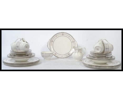 A Royal Doulton tea and dinner service in the Infinity pattern H5111 consisting of six tea cup , saucers and side plates , cr