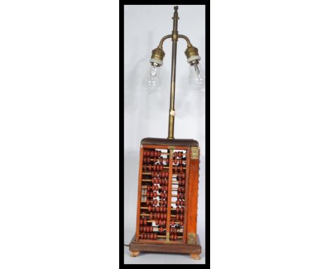 An unusual Chinese style table lamp of abacus form, constructed from four abacus in cube form.