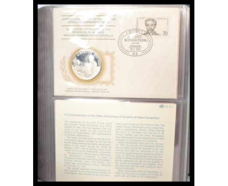 An album of thirty six proof silver medallions mounted on first day cover issues for the International Society of Postmasters