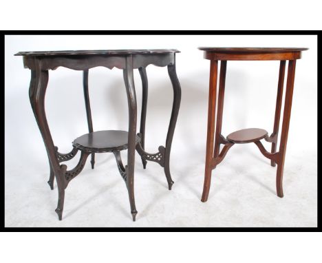 An Edwardian Art Nouveau ebonised centre table having pierced frieze on shaped legs together with an Edwardian mahogany inlai