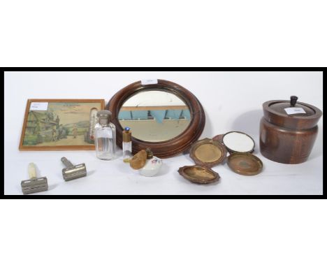 A mixed lot to include a wooden tobacco pot a perfume bottle, circular mirror , razors , compacts , bottles , advertising the