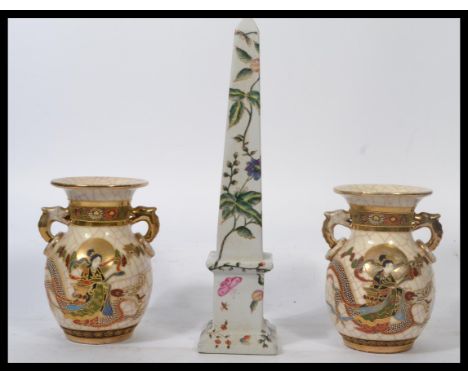 A pair of 20th century Japanese Satsuma bulbous vases with scenes of warriors, character marks to base together with a Chines