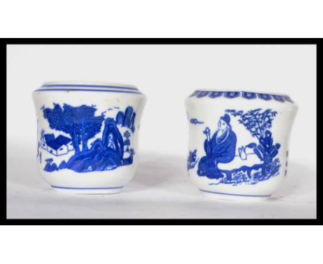 Two 19th century Chinese blue and white brush / water pots decorated with traditional scenes and calligraphy. Four blue chara