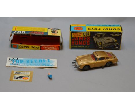 Corgi Toys No. 261 Special Agent 007 James Bond's Aston Martin DB5, in gold. Includes inner display stand, 2 bandit figures, 